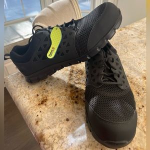 Reebok memory tech massage size 15W alloy toe shoes. Tried on but never worn.